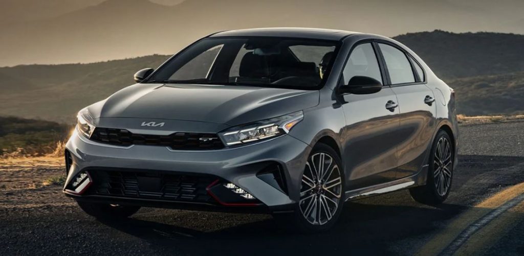 A silver 2022 Kia Forte parked in the road is a deserted area. | Kia dealer in Bentonville, AR.