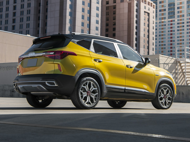 Profile view of a golden yellow 2023 Kia Seltos. | Kia dealer in Bentonville, AR.